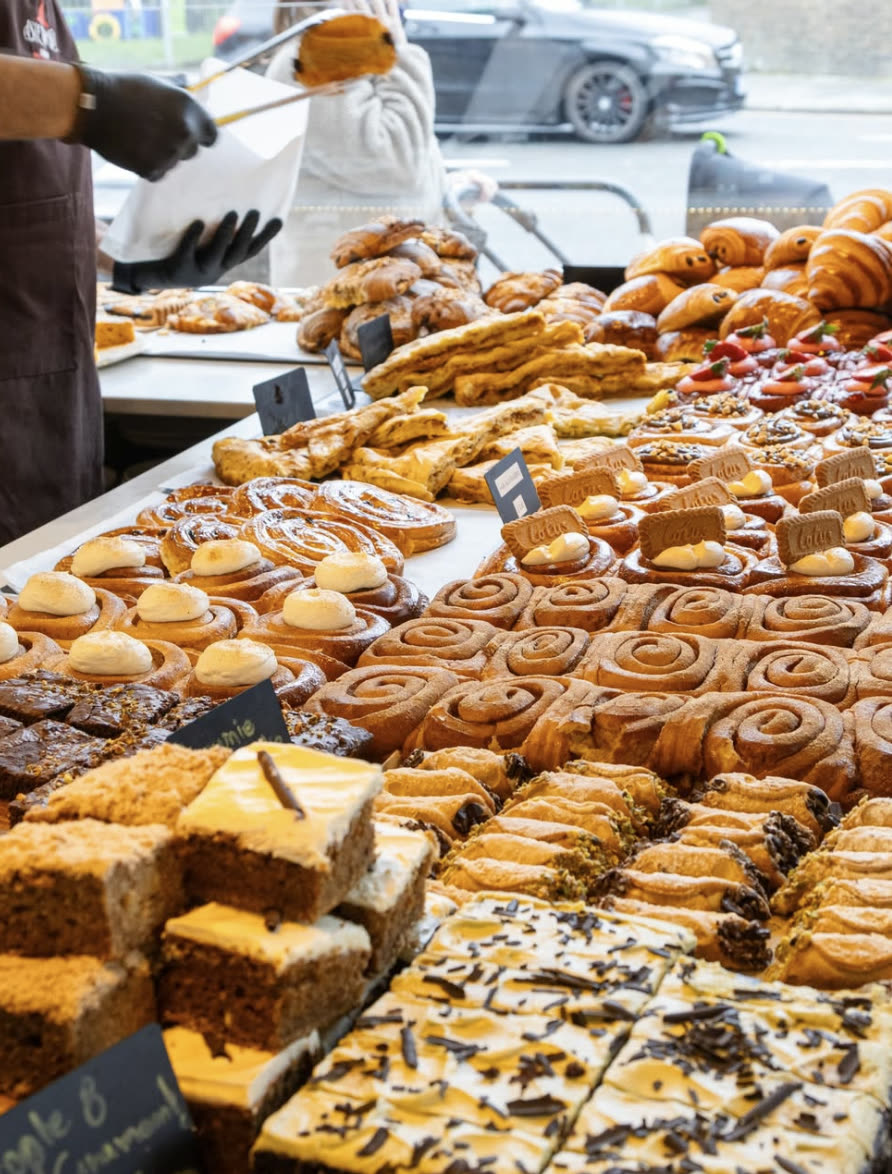 Cinnamon rolls, brownies and Lotus buns at the market stall.