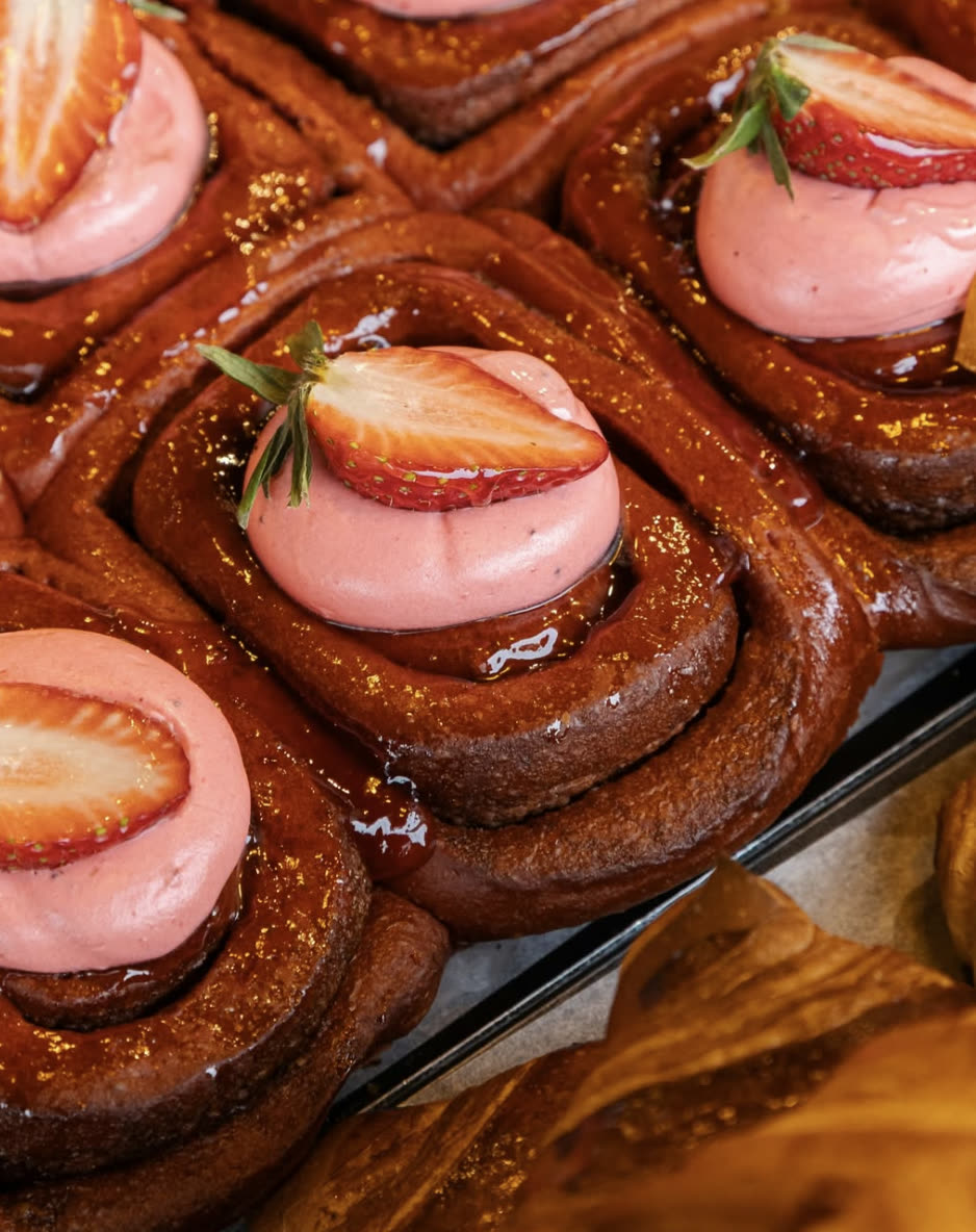 Strawberry cream brioche buns glistening with glaze.